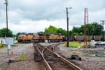 A southbound coal train slams the diamonds 